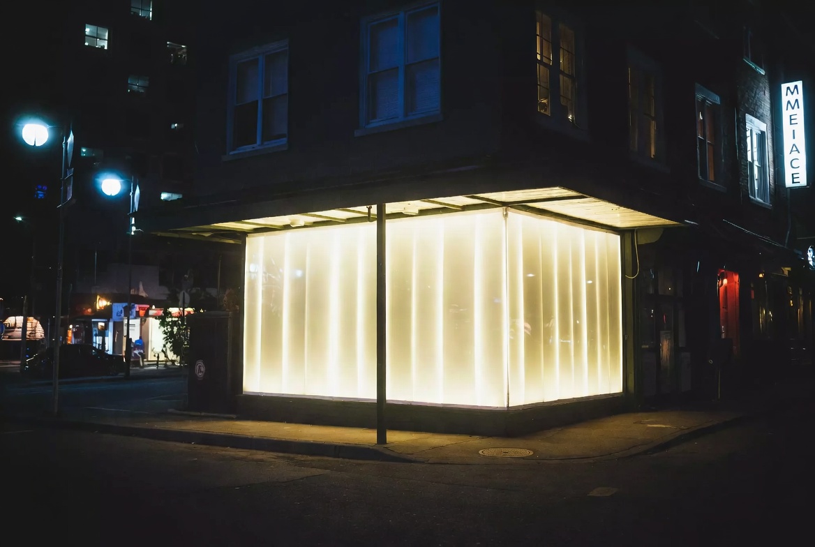 Illuminated Storefront Signage At Night Illuminated Storefront Signage At Night